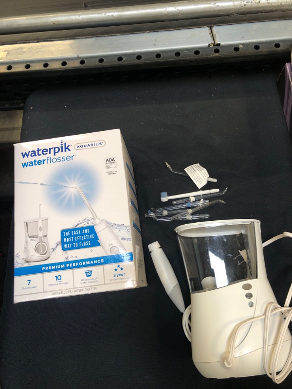 Photo 2 of Waterpik Aquarius Water Flosser Professional For Teeth, Gums, Braces, Dental Care, Electric Power With 10 Settings, 7 Tips For Multiple Users And Needs, ADA Accepted, White WP-660 ( USED ITEM ) 
