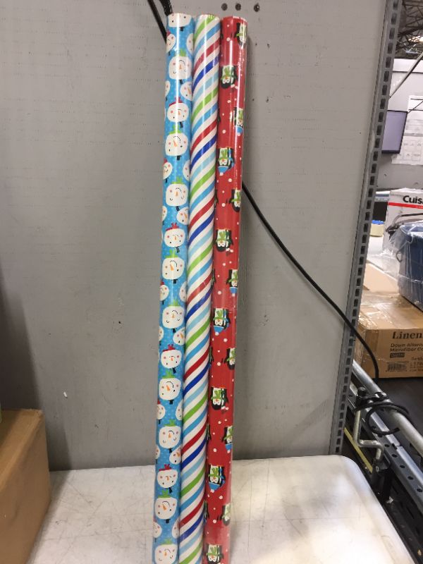 Photo 2 of American Greetings Christmas Reversible Wrapping Paper Bundle, Stripes, Blue Snowmen And Red Penguins (3 Rolls, 120 sq. ft.)