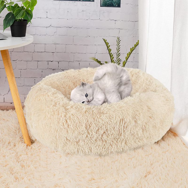 Photo 1 of Calming Dog and Cat Bed, Round Doughnut Washable Dog Bed, Warm and Comfortable Soft Dog Round Bed, Fluffy Faux Fur Plush Donut Throw Blanket Anti-Anxiety cat Bed for Small to Medium Dogs and Cats 23"