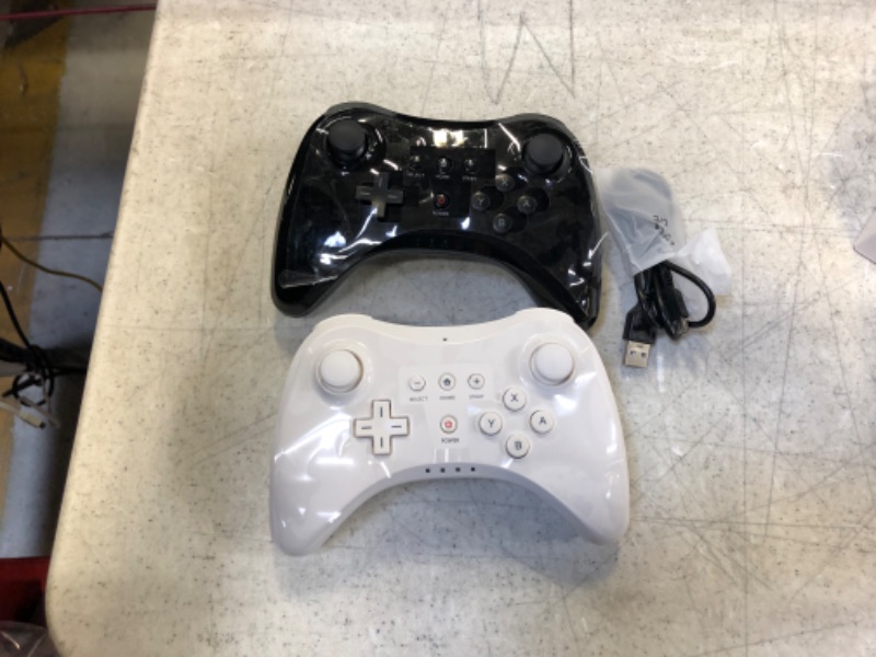 Photo 1 of gaming controllers 2 pack white and black 