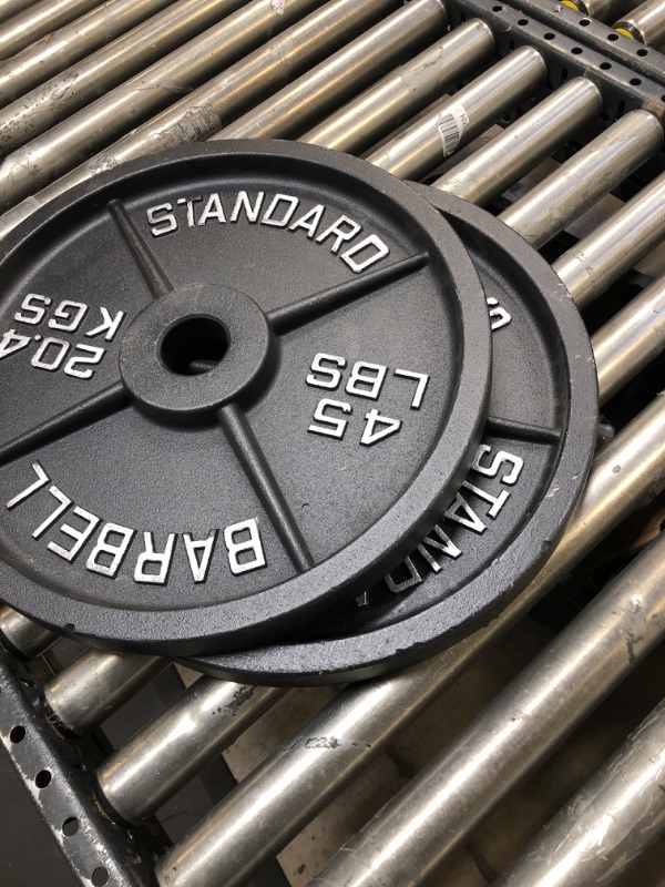 Photo 1 of 45LB Standard Barbell Weight Plate (2 Pack) ---------barely used------minor scratches due to usage 