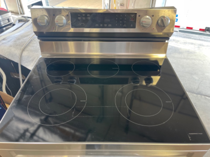 Photo 2 of 6.3 cu. ft. Smart Freestanding Electric Range, DENTED TOP PORTION, MINOR USE. 