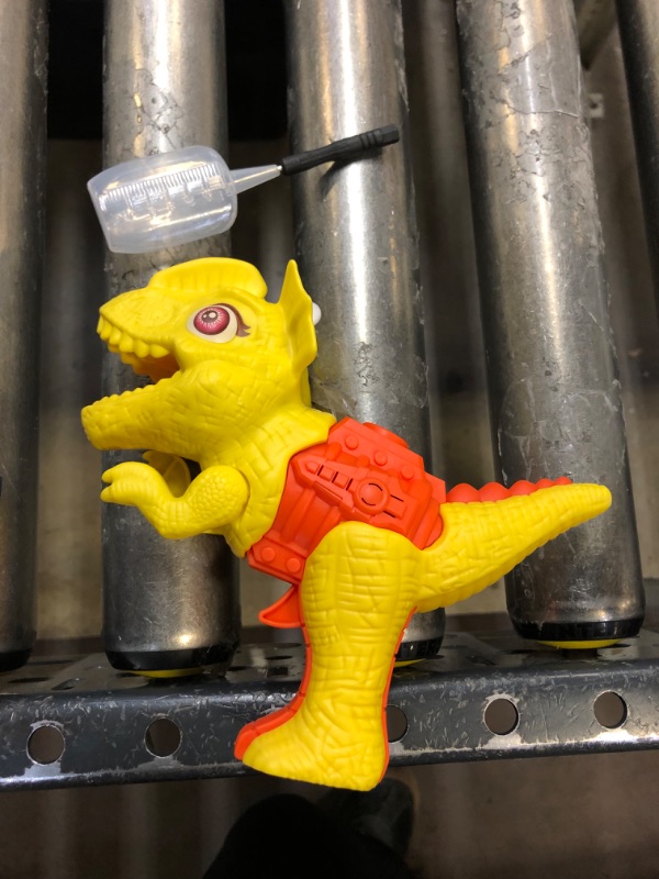 Photo 1 of yellow dinosaur water gun