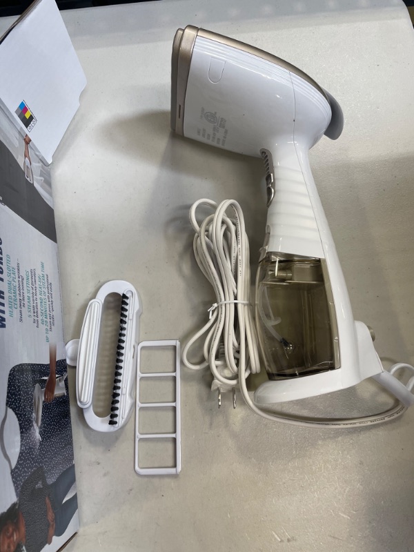 Photo 2 of Conair Turbo ExtremeSteam Hand Held Fabric Steamer, White/Champagne ( BOX HAS MINOR DAMAGE) 