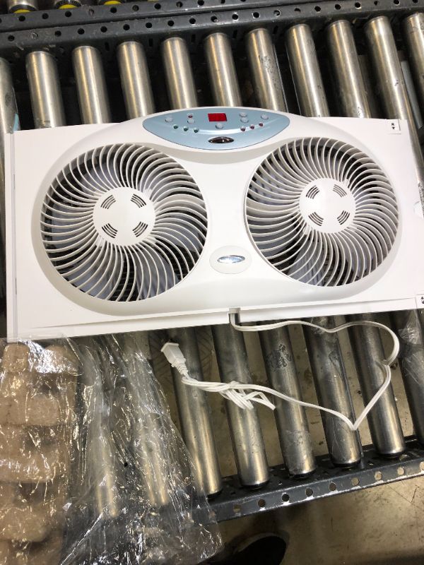 Photo 2 of Bionaire Window Fan with Twin 8.5-Inch Reversible Airflow Blades and Remote Control, White
