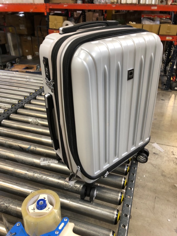 Photo 2 of DELSEY Paris Titanium Intl 20.5'' Expandable Spinner Suitcase - Silver - locked. missing key.