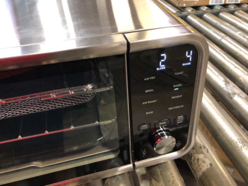 Photo 2 of Ninja SP201 Digital Air Fry Pro Countertop 8-in-1 Oven with Extended Height, XL Capacity, Flip Up & Away Capability for Storage Space, with Air Fry Basket, Wire Rack & Crumb Tray, Silver
