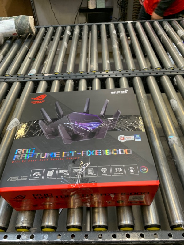 Photo 2 of ASUS ROG Rapture WiFi 6E Gaming Router (GT-AXE16000) - Quad-Band, 6 GHz Ready, Dual 10G Ports, 2.5G WAN Port, AiMesh Support, Triple-Level Game Acceleration, Lifetime Internet Security, Instant Guard, Box Packaging Damaged, Minor Use, Item Turns on.
