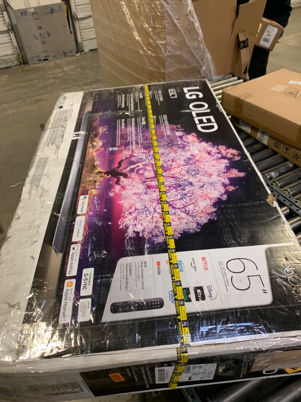 Photo 2 of LG C1 Series 65-Inch Class OLED Smart TV OLED65C1PUB, 2021 - 4K TV, Alexa Built-in, Box Packaging Damaged, Minor Use, Missing Stand, Item Turns on.
