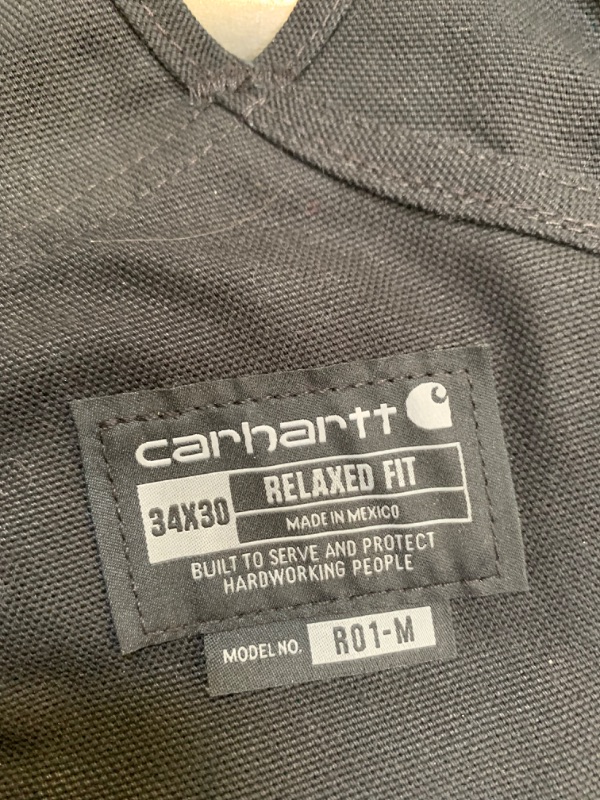 Photo 5 of Black CArhartt Relaxed Fit Overalls, 34x30, No Box Packaging. Moderate Use, Slightly Dirty From Previous Use, Minor Tears in Fabric