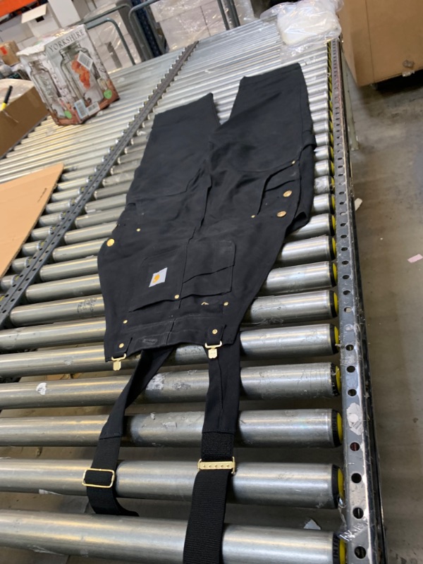 Photo 1 of Black CArhartt Relaxed Fit Overalls, 34x30, No Box Packaging. Moderate Use, Slightly Dirty From Previous Use, Minor Tears in Fabric