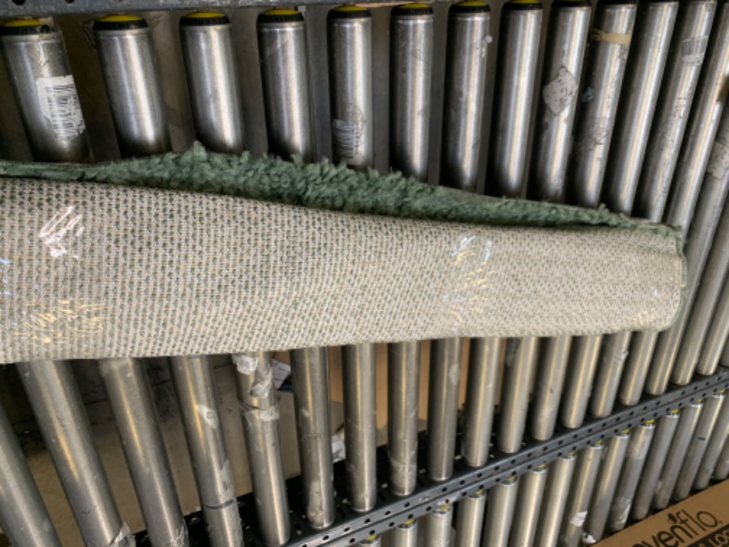 Photo 1 of 3'x5' Green Area Rug, No Box Packaging, Minor Use, Minor Fraying on Edges, Creases and Wrinkles in Rug, Dirty From Shipping and Handling, Tape on Rug
