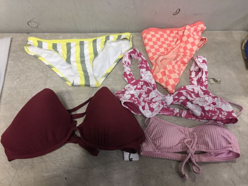 Photo 1 of BAG LOT OF WOMEN'S BIKINIS -BOTTOMS AND TOPS - DIFFERENT STYLES AND SIZES ---SOLD AS IS --