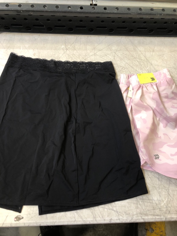 Photo 1 of WOMENS SKIRT AND SHORTS. SIZES, M,L