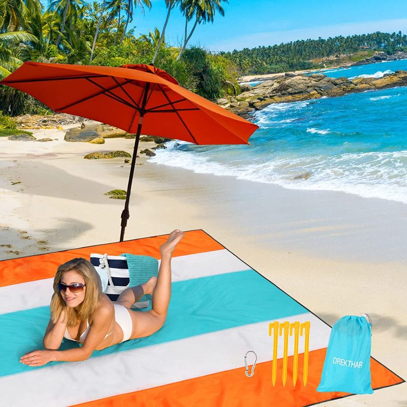 Photo 1 of  Beach Blanket,112’’×120’’Oversized Waterproof Blanket,Portable Picnic Blanket Suitable for 5-8 Adults,with 4 Corner Sand Pockets & Plastic Stakes,Be fit for Travel,Camping and Beach Parties
