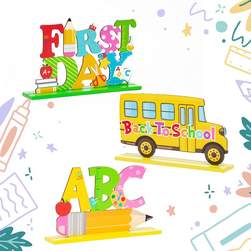 Photo 1 of G1ngtar 3Pcs Welcome Back to School Table Decoration Set First Day of School Wooden Table Centerpieces School Bus ABC Pencil Sign Photo Props Teacher Supplies for School Classroom Kindergarten 3 PACK 
