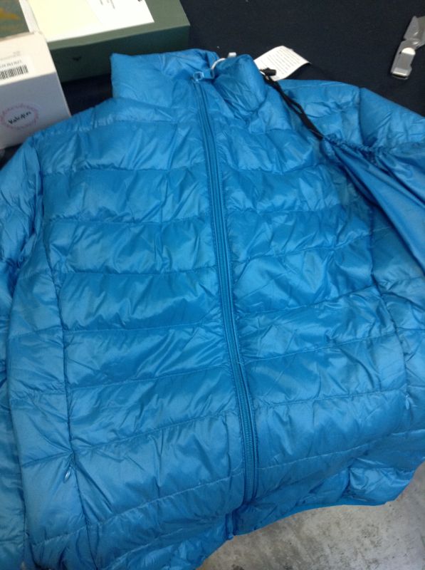 Photo 1 of kids size medium puffer jacket 