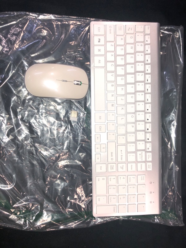Photo 1 of Wireless Keyboard and Mouse,J JOYACCESS USB Slim Wireless Keyboard Mouse with Numeric Keypad Compatible with iMac Mac PC Laptop Tablet Computer Windows (Silver White)