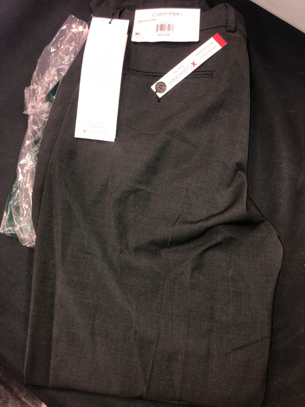 Photo 1 of Calvin Klein Mens Slim Fit, infiniti stretch, Suit Separates. DRESS PANTS, COLOR CHARCOAL, SIZE 34W X 32 L