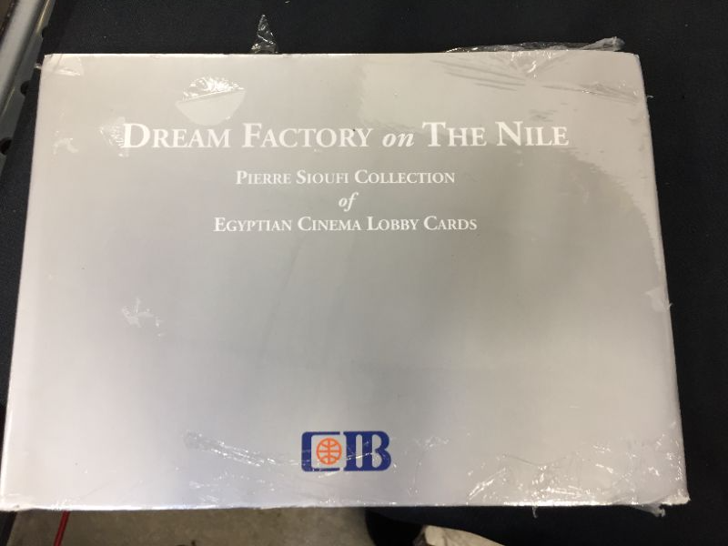 Photo 1 of Dream Factory on the Nile: Pierre Sioufi Collection of Egyptian Cinema Lobby Cards Hardcover – Illustrated, January 5, 2021
