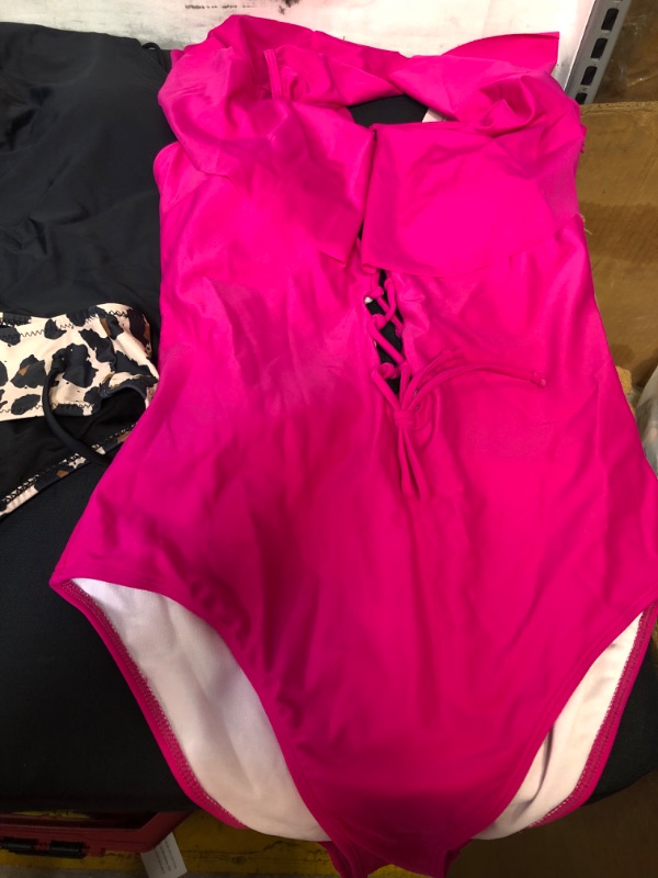 Photo 1 of BAG LOT OF WOMENS SWIMWEAR SIZE L (PINK SWIMWEAR IS SIZE M) ---SOLD AS IS ---