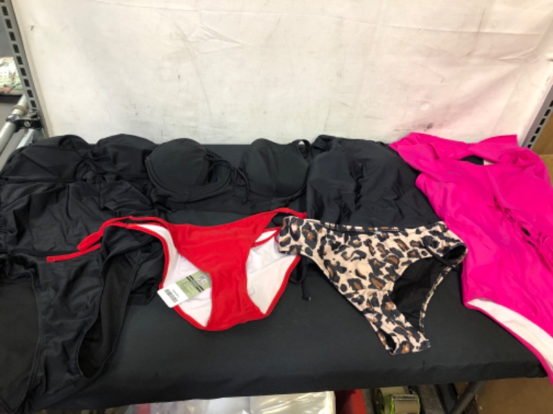 Photo 1 of BAG LOT OF WOMENS SWIMWEAR SIZE L (PINK SWIMWEAR IS SIZE M) ---SOLD AS IS ---