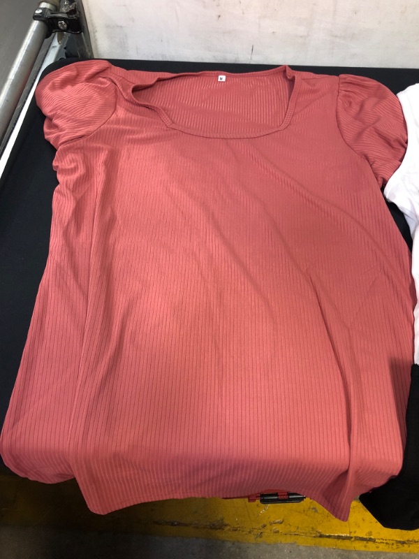 Photo 2 of BAG OF WOMENS CLOTHING ITEMS- PINK SHIRT SIZE M,  4 PACK OF CROP TOPS SIZE L, 4 PACK OF TANKS SIZE M ---- SOLD AS IS ----  
