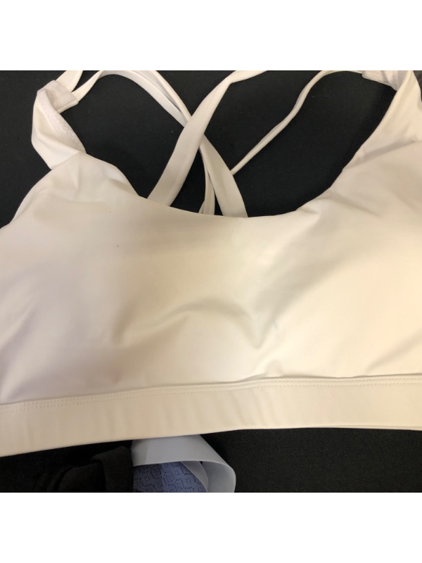 Photo 4 of BAG LOT OF WOMENS CLOTHING- BLACK CROP WITH ROSE SIZE M ( WHITE STAIN), WHITE SPORTS BRA SIZE L (BLUE STAIN IN THE CENTER), BLUE HANES BRA SIZE M (YELLOW STAIN INSIDE BRA), BLACK HEAD BAND ---- SOLD AS IS ----