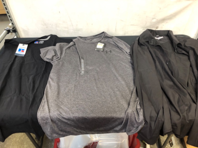 Photo 1 of BAG OF MENS SHIRTS- RUSSELL ATHLETIC TANK SIZE L, UNDER ARMOUR SHIRT GREY SIZE M, BLACK BUTTON UP SIZE XL --- SOLD AS IS ---