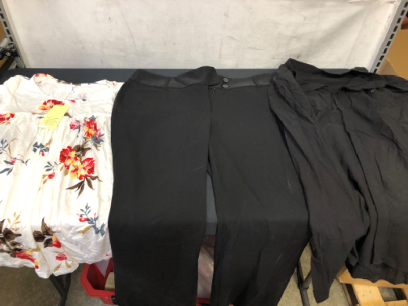 Photo 1 of BAG LOT OF WOMENS ITEMS- BLACK BUTTON UP SHIRT SIZE XL, WHITE- FLOWER PRINT SHIT IS SIZE L, AND DRESS PANTS SIZE 12 
( PANTS HAVE A BUTTON MISSING AND HAS STAINS) 