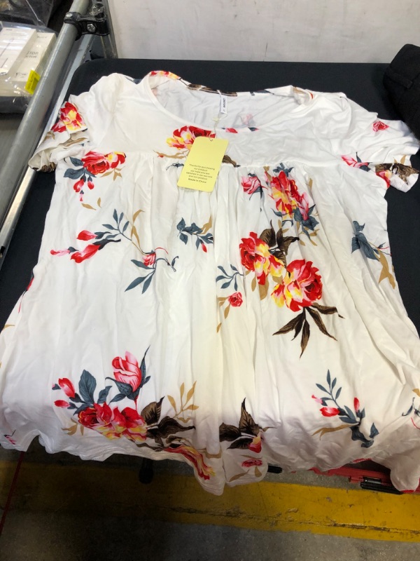 Photo 3 of BAG LOT OF WOMENS ITEMS- BLACK BUTTON UP SHIRT SIZE XL, WHITE- FLOWER PRINT SHIT IS SIZE L, AND DRESS PANTS SIZE 12 
( PANTS HAVE A BUTTON MISSING AND HAS STAINS) 