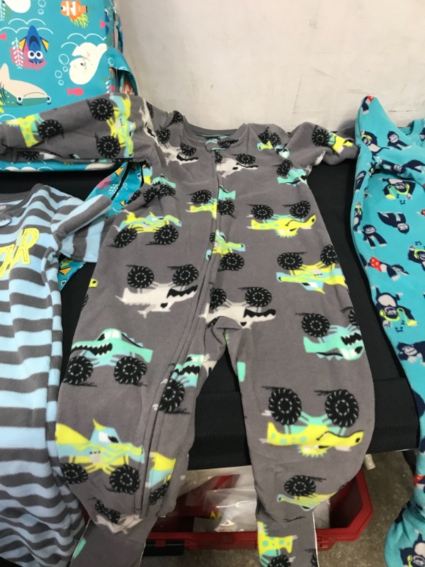 Photo 3 of BAG LOT OF KIDS ITEMS- 3 PIECE ONESIES SIZE 3T, TODDLER BOOSTER SEAT DINING (HAS STAINS), TWO ELECTRIC SOFT FISH 
--- SOLD AS IS ----