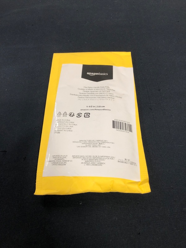 Photo 1 of Amazon Basics 1-1/2" Flex Nylon Handle Putty Knife
