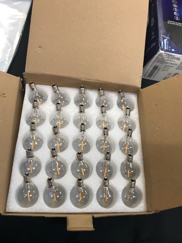 Photo 1 of box of mini light bulbs 