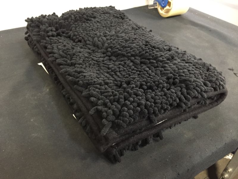 Photo 1 of black bath rug 