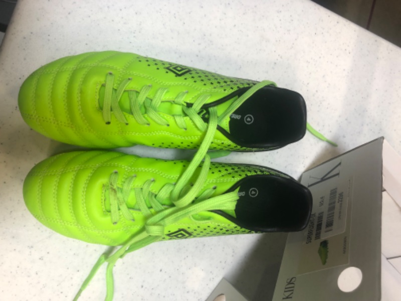 Photo 2 of kids soccer cleats neon green size 4  