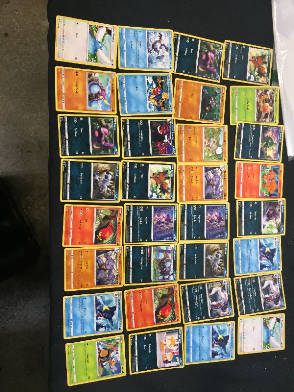 Photo 1 of 49 pc pokemon cards 