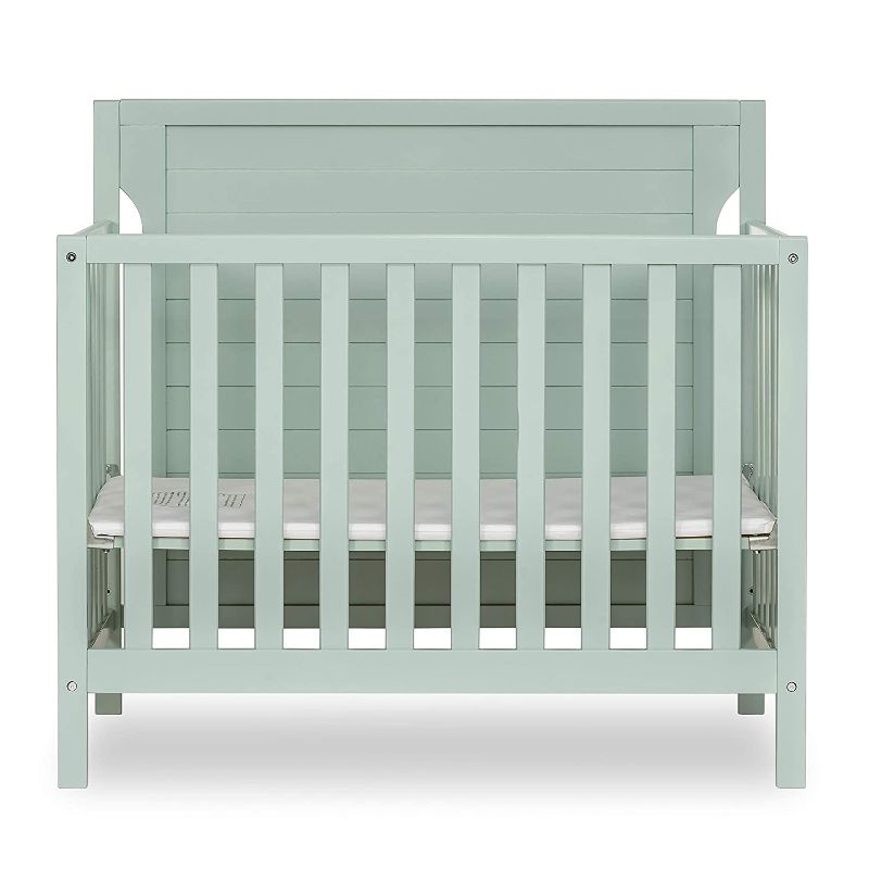 Photo 1 of Dream On Me Bellport 4 in 1 Convertible Mini/Portable Crib I Mini Baby Crib I Includes 1.5 Mattress, Light Seafoam Green. Box Packaging Badly Damaged, Heavy Use, Hardware Loose in Box, Missing Hardware, Damage to Wood as shown in Pictures. Selling for Par