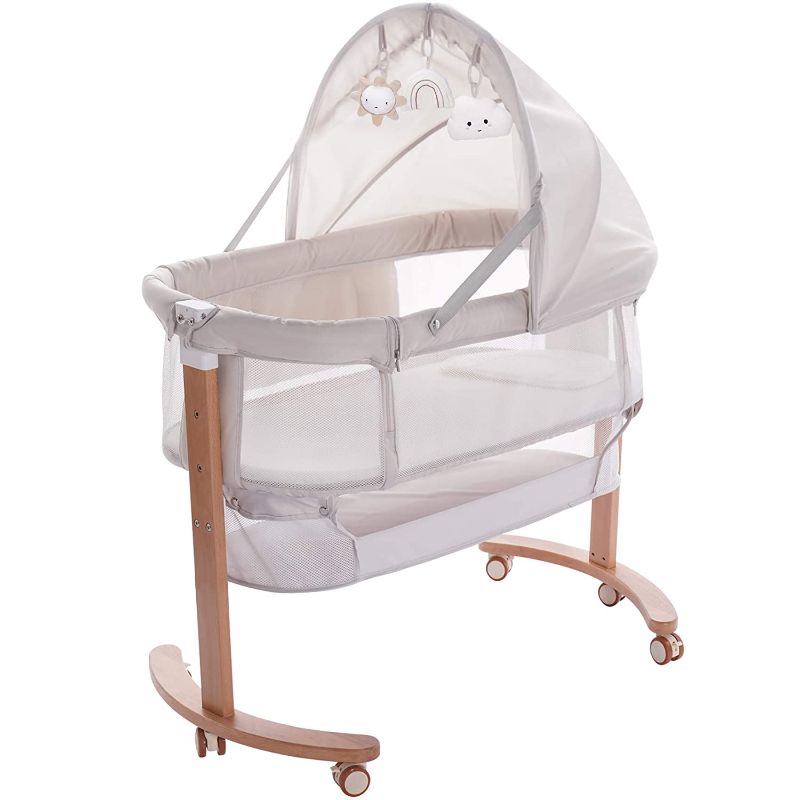 Photo 1 of Baby Bassinet Bedside Sleeper with Wheels Storage Basket Canopy 3 Hanging Toys Newborn Cosleeping Cribs for Infant Wooden Crib Adjustable Boy Girl Multi-Functional Bedside Sleeper. Box Packaging Damaged, Minor Use, Scratches and Scuffs found on Metal. 