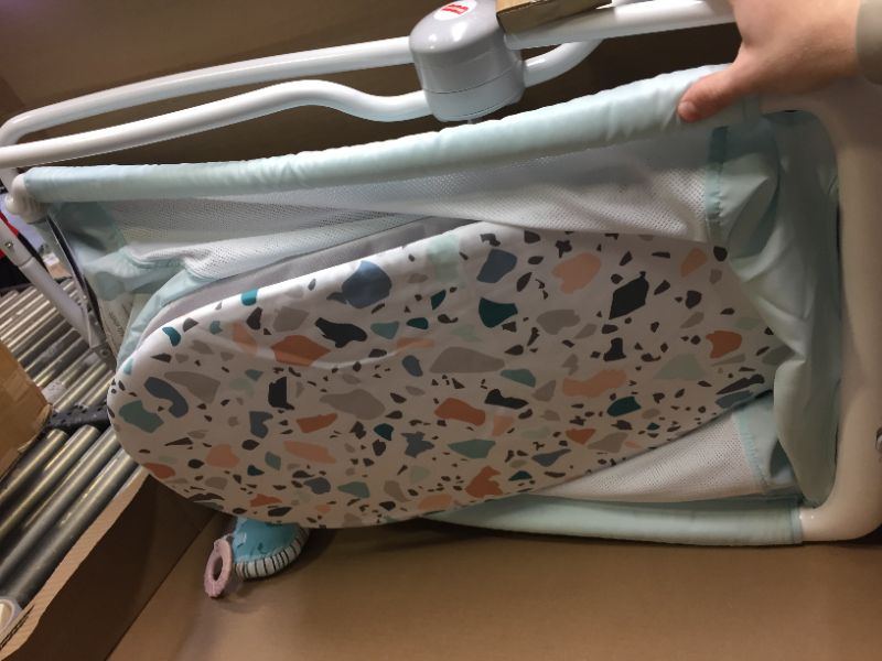 Photo 6 of Fisher-Price Rock with Me Bassinet Pacific Pebble. Box Packaging Damaged, Moderate Use, Hair Found on item, Scratches and Scuffs found on item. 
