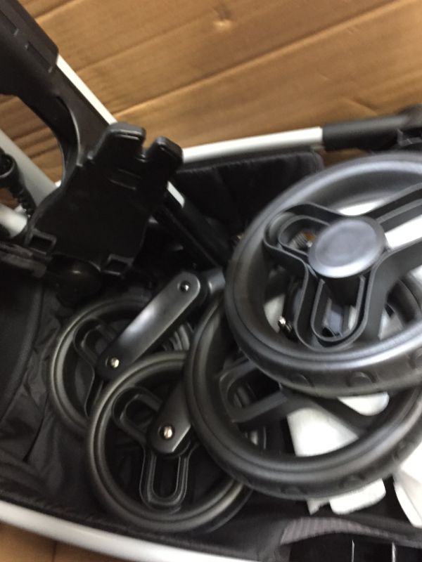 Photo 11 of OMNI PLUS MODULAR TRAVEL SYSTEM WITH LITEMAX SPORT REAR-FACING INFANT CAR SEAT. Box Packaging Badly Damaged, Moderate Use, May be Missing Parts, Scratches and Scuffs on item. Wear on Wheels.  Minor Stains found on item, Dirty from Previous Use. 