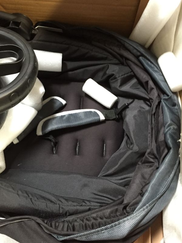 Photo 7 of OMNI PLUS MODULAR TRAVEL SYSTEM WITH LITEMAX SPORT REAR-FACING INFANT CAR SEAT. Box Packaging Badly Damaged, Moderate Use, May be Missing Parts, Scratches and Scuffs on item. Wear on Wheels.  Minor Stains found on item, Dirty from Previous Use. 