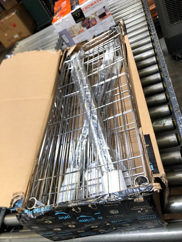 Photo 3 of Amazon Basics 5-Shelf Adjustable, Heavy Duty Storage Shelving Unit (350 lbs loading capacity per shelf), Steel Organizer Wire Rack, Chrome (36L x 14W x 72H) Box Packaging Damaged, Item is New, Item is Badly Damaged, Dents on Metal Tier as Shown in Picture
