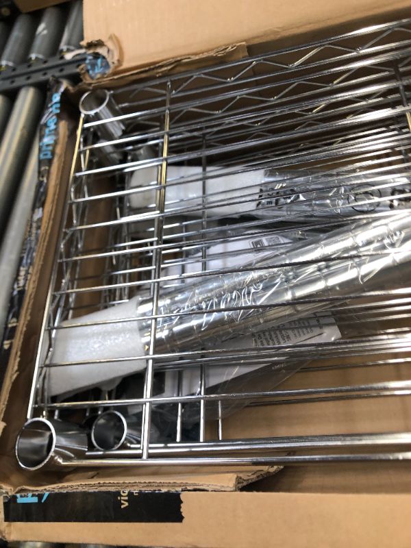Photo 9 of Amazon Basics 5-Shelf Adjustable, Heavy Duty Storage Shelving Unit (350 lbs loading capacity per shelf), Steel Organizer Wire Rack, Chrome (36L x 14W x 72H) Box Packaging Damaged, Item is New, Item is Badly Damaged, Dents on Metal Tier as Shown in Picture