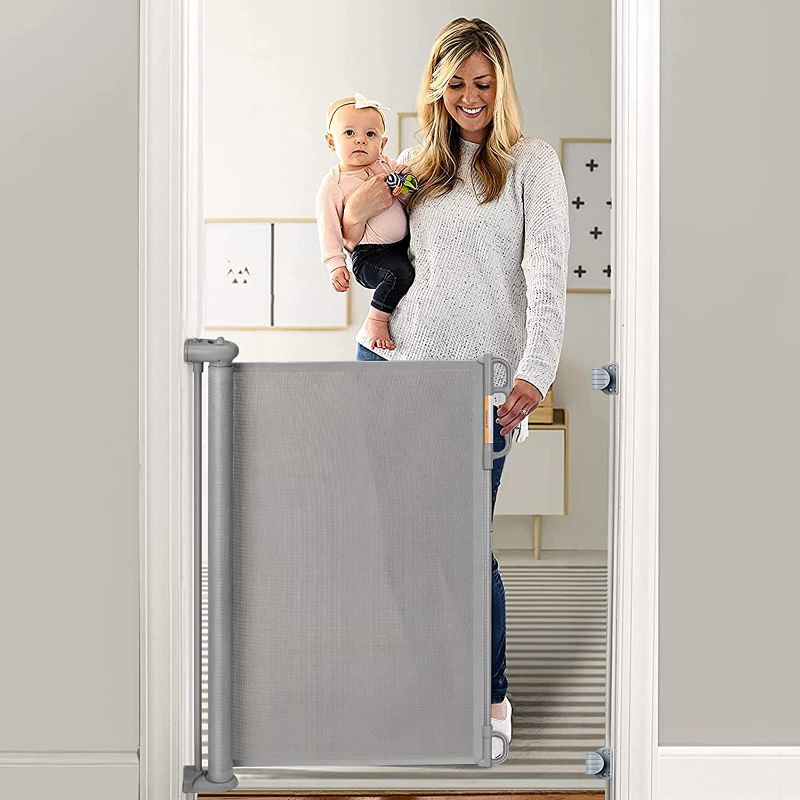 Photo 1 of Momcozy Retractable Baby Gate, 33" Tall, Extends up to 55" Wide, Child Safety Baby Gates for Stairs, Doorways, Hallways, Indoor, Outdoor.  Box Packaging Damaged, Minor Use. 