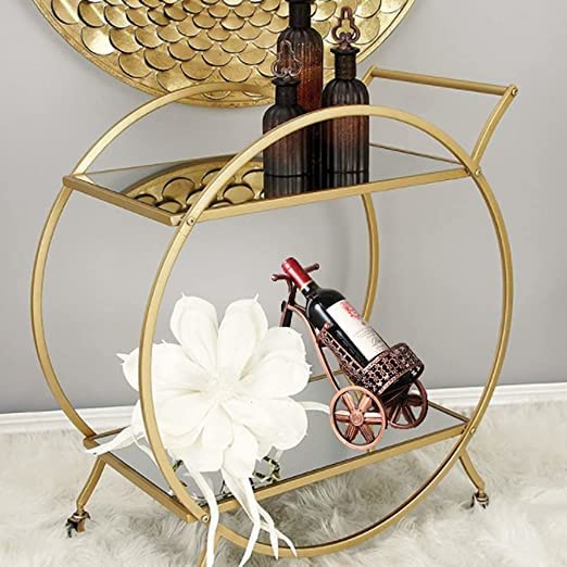 Photo 1 of  HEONITURE Bar Cart with 2 Mirrored Shelves, Modern Metal Bar Serving Cart, Gold Round Bar Carts for The Home/Kitchen/Club/Living Room, Rolling Wheeled Design (28.34''14.96''30.7'') Missing Parts, Scratches and Scuffs on item, Hardware Not in Original Pac