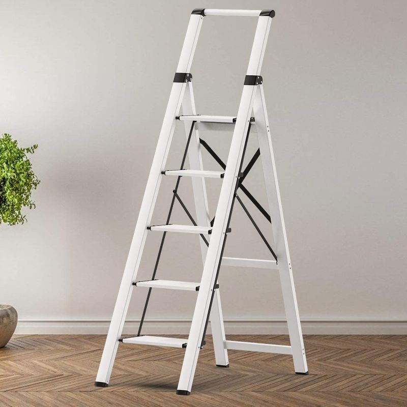 Photo 1 of 5 Steps Lightweight Aluminum Ladder Folding Step Stool Stepladders with Anti-Slip and Wide Pedal for Home and Kitchen Use Space Saving (Silver) Box Packaging Badly Damaged, Moderate Use, Scratches and SCuffs on item, Missing Bottom Foot Pads. 
