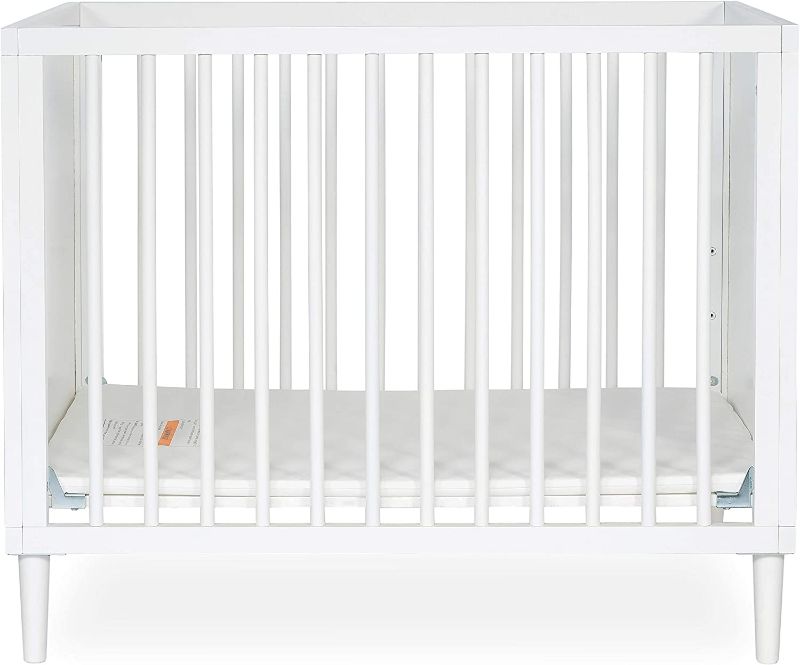 Photo 1 of Dream On Me Lucas Mini Modern Crib with Rounded Spindles in White , 39x25.5x33 Inch (Pack of 1) Box Packaging Damaged, Item is New.
