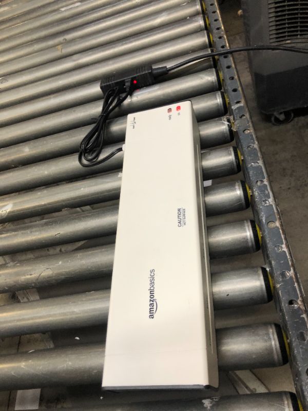 Photo 1 of Amazon Basics 12-Inch Thermal Laminator Machine. Moderate Use, Scratches and scuffs on item, Item Turns on.  Box Packaging Badly Damaged, 