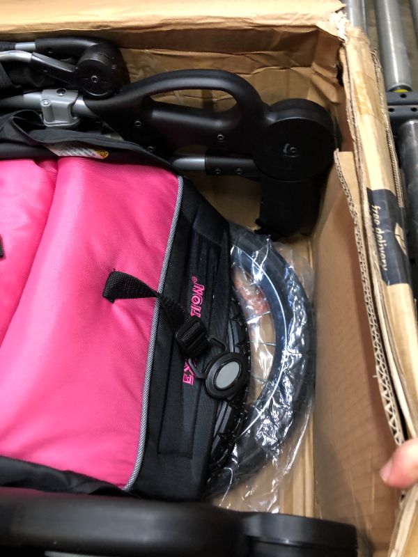 Photo 9 of Baby Trend Expedition Jogger Stroller, Bubble Gum. Box Packaging Damaged, Heavy Use, Scratches and Scuffs on Plastic, Found Rip in Fabric, Found Hair on item, Wear on wheels. Missing small hardware for Wheels.
